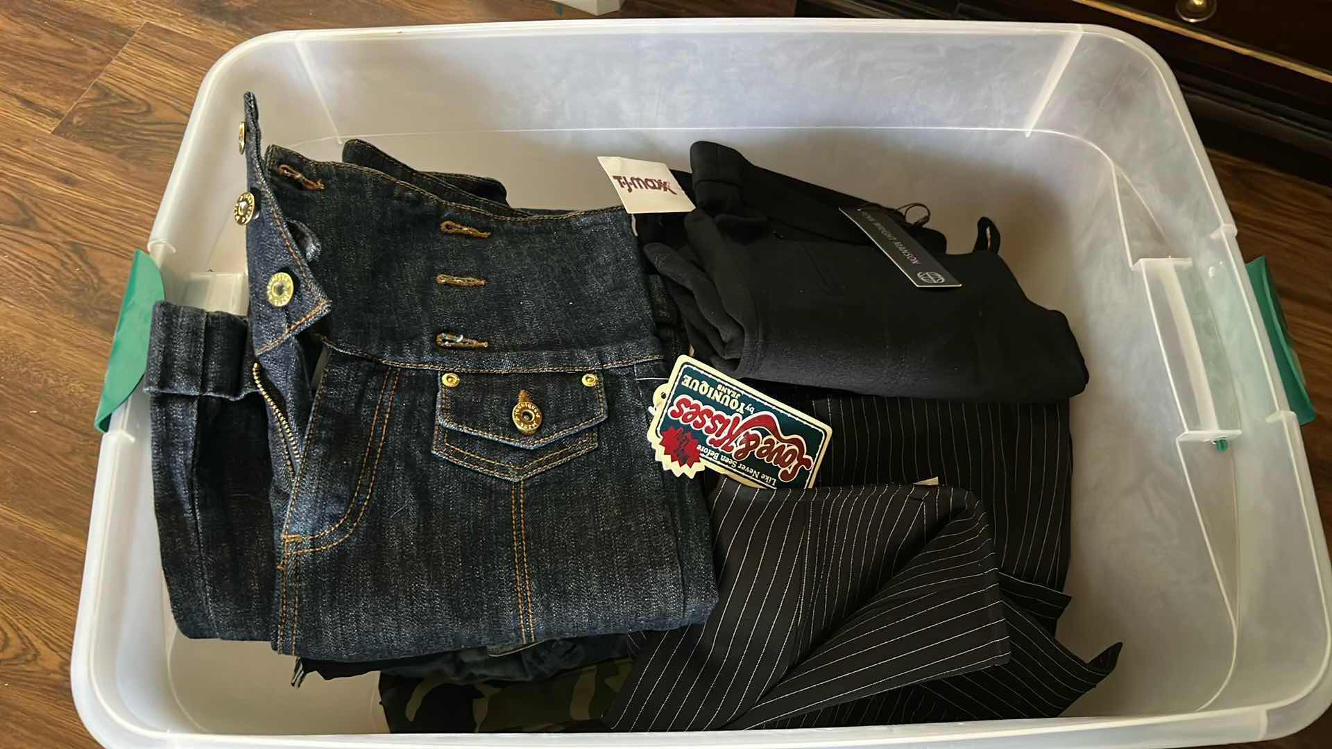 Photo 1 of CONTENTS OF PLASTIC CONTAINER ASSORTED WOMENS PANTS SIZE 6,8,10