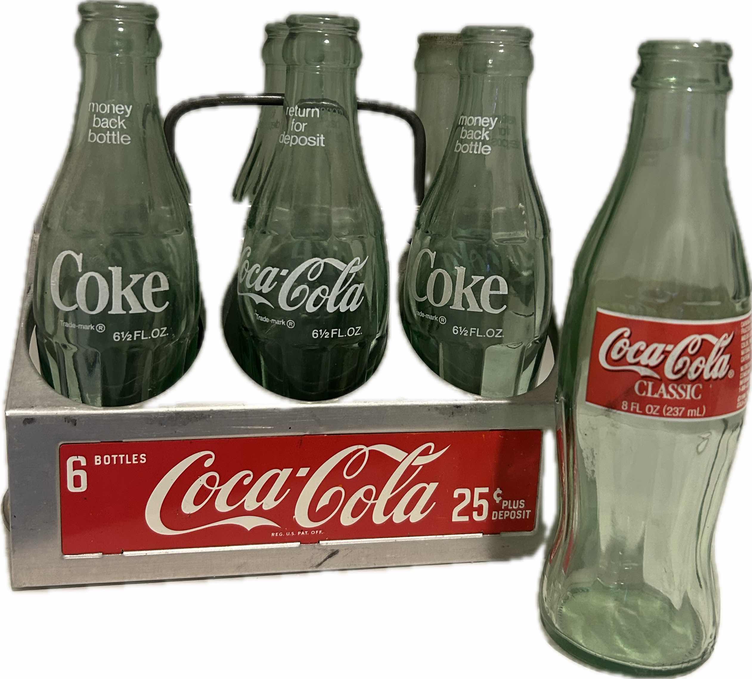 Photo 1 of VINTAGE COCA- COLA SIX PACK BOTTLE CARRIER w 7 BOTTLES