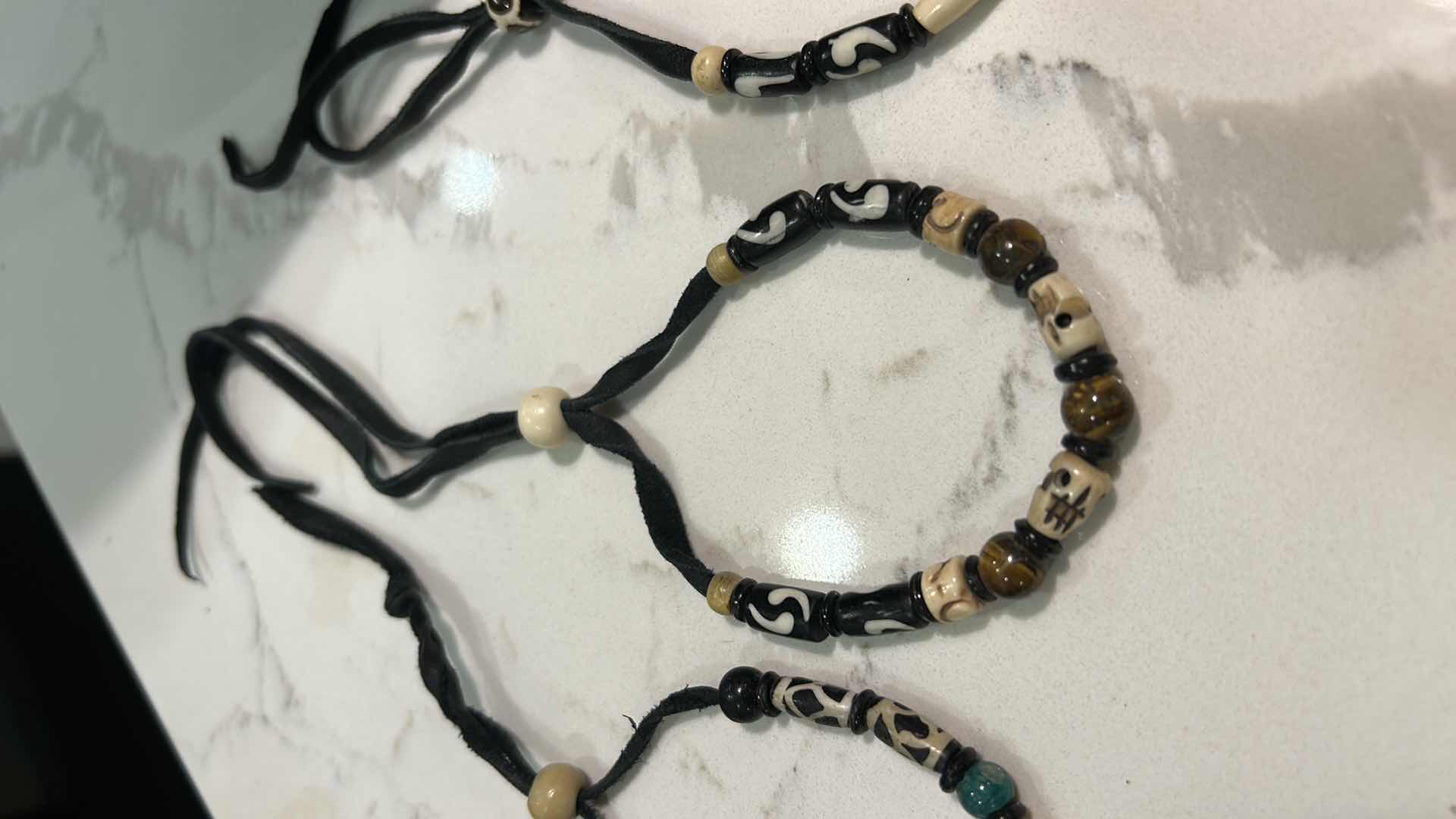 Photo 1 of JEWELRY- 3 BEADED LEATHER BRACELETS
