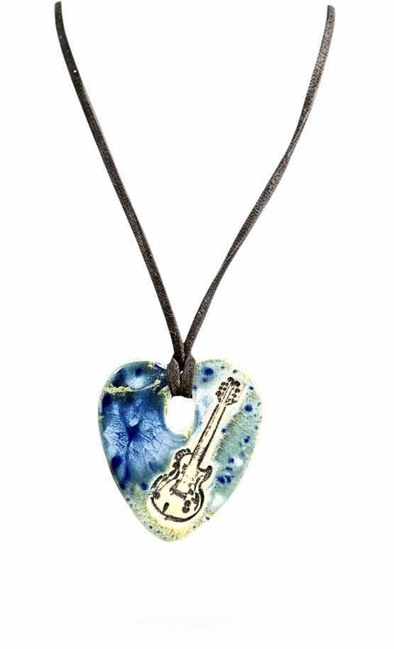 Photo 1 of MEN / WOMENS JEWELRY- FROM THE BRAND SURLY-RAMICS, HAND FORMED, HAND PAINTED BY ARTIST AMY DAVID ROTH, CERAMIC HEART WITH GUITAR MADE FROM EARTHENWARE CLAY, FIRED TWICE AND FINISHED WITH LEAD FREE FOOD SAFE GLAZES. EACH PIECE IS UNIQUE