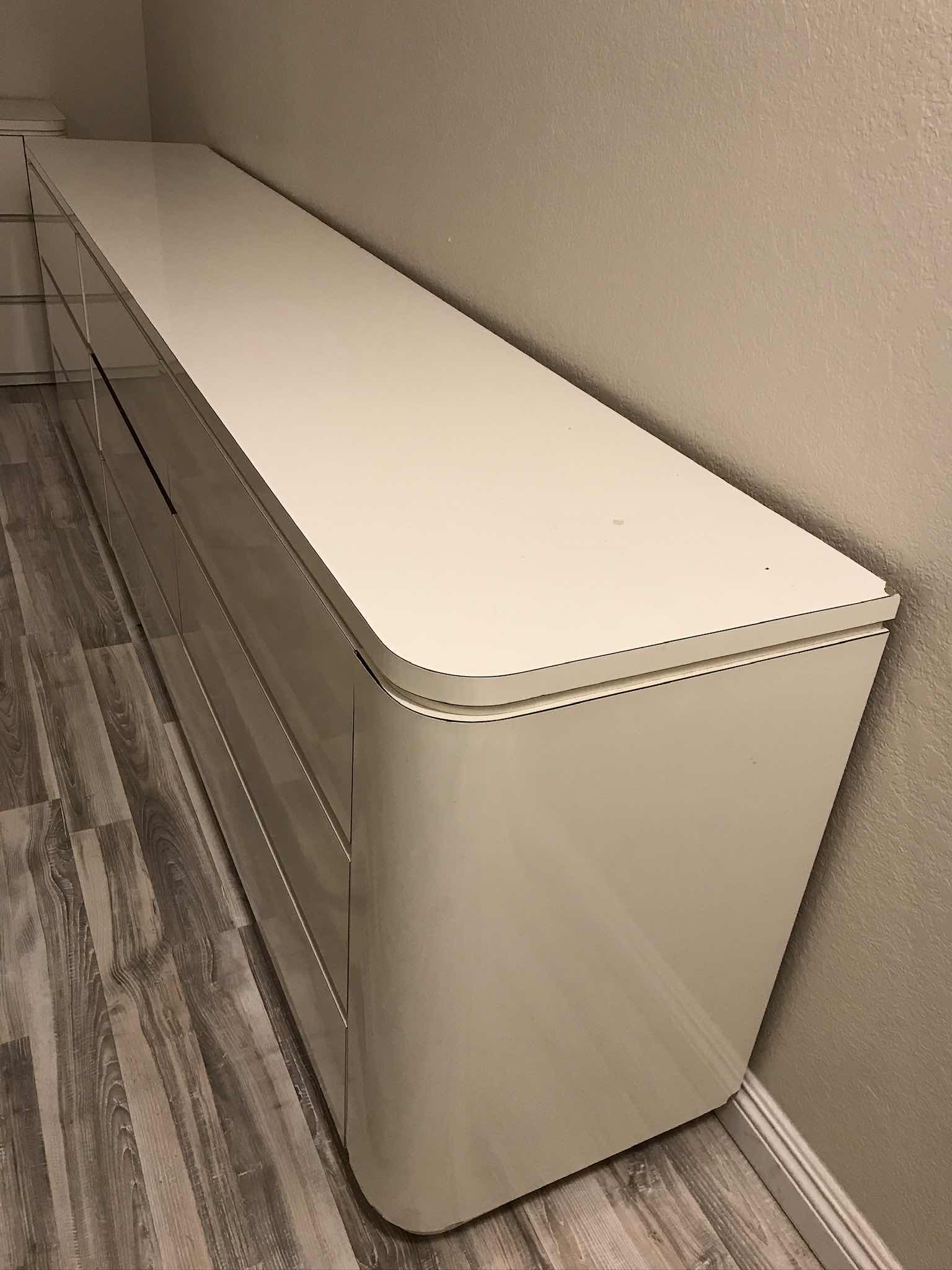 Photo 1 of POSTMODERN WATERFALL LAMINATED LACQUERED 
9 DRAWER DRESSER 
102 X 18 X 30
MORE OF THIS COLLECTION IN AUCTION