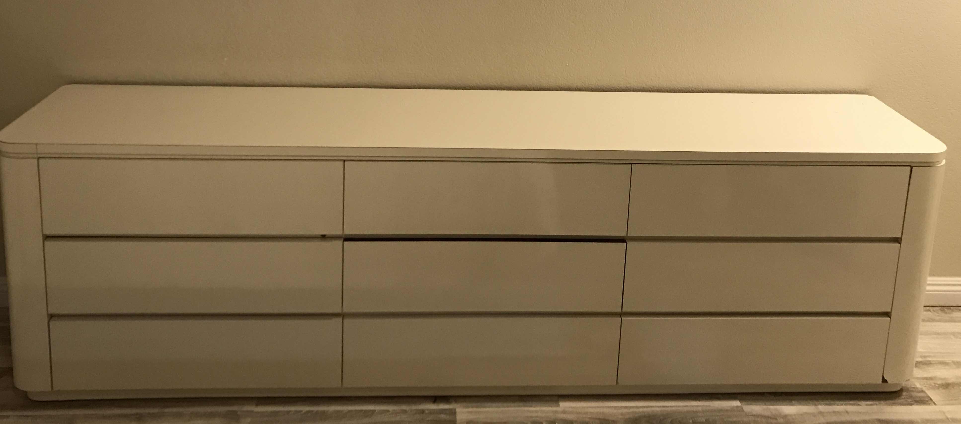 Photo 1 of POSTMODERN WATERFALL LAMINATED LACQUERED 
9 DRAWER DRESSER 
102 X 18 X 30
MORE OF THIS COLLECTION IN AUCTION