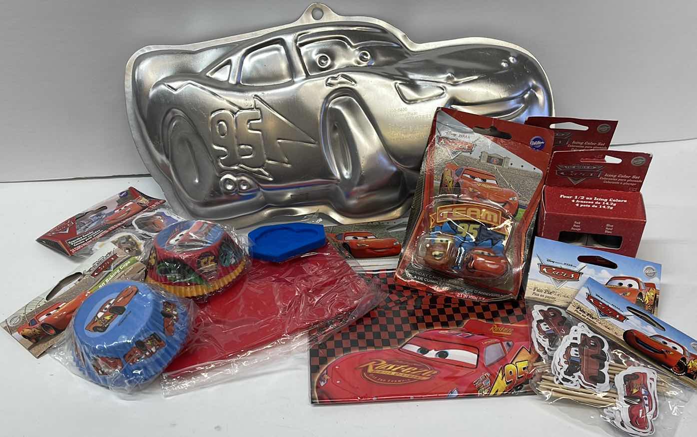 Photo 1 of NEW DISNEY CARS PARTY , LIGHTING MCQUEEN CAKE PAN , CUPCAKE LINERS , GOODIE BAGS , TOPPERS AND MORE - RETAIL PRICE $61.99