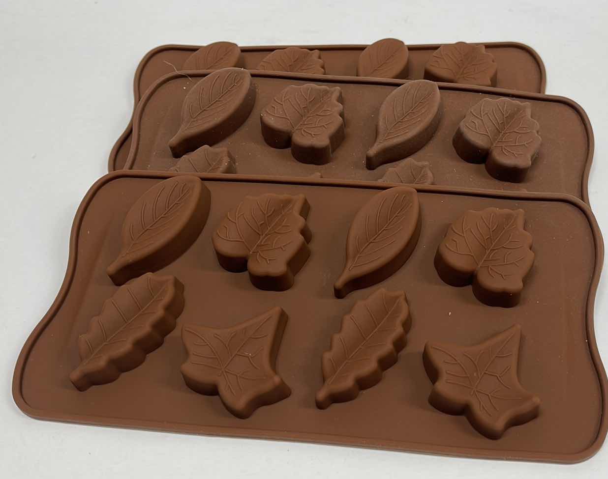 Photo 1 of NEW 3 SILICONE AUTUMN LEAVES CHOCOLATE / CANDY / ICE MOLDS - TOTAL RETAIL PRICE $22.00