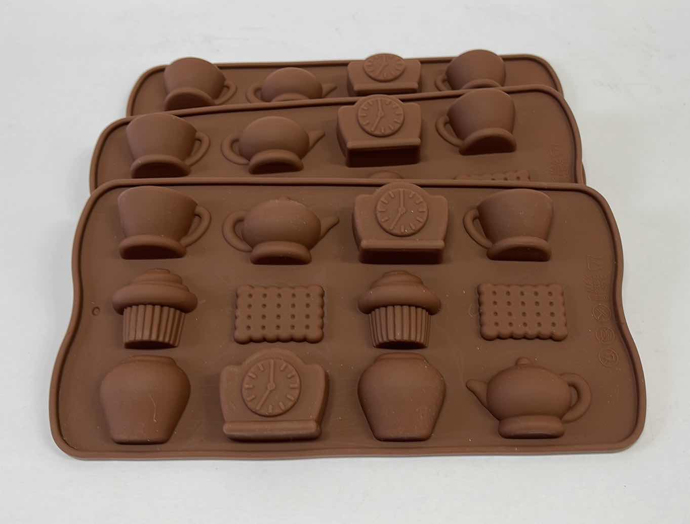 Photo 1 of NEW 3 SILICONE TEA TIME CHOCOLATE / CANDY / ICE MOLDS - TOTAL RETAIL PRICE $22.00