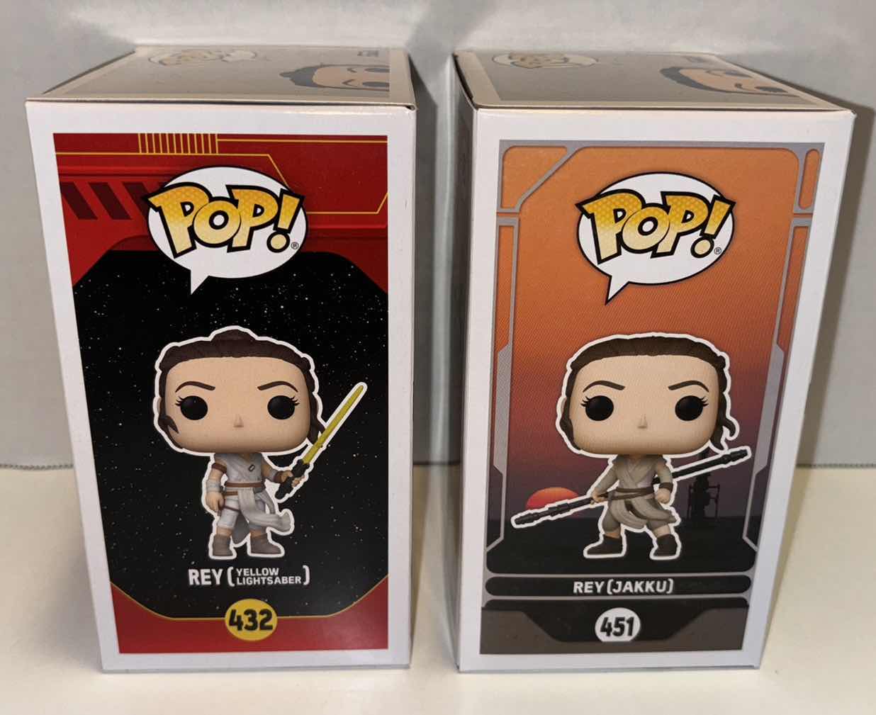 Photo 1 of NEW FUNKO POP! STAR WARS BOBBLE-HEAD VINYL FIGURE 2-PACK, #432 REY (YELLOW LIGHTSABER) & #451 REY (JAKKU)