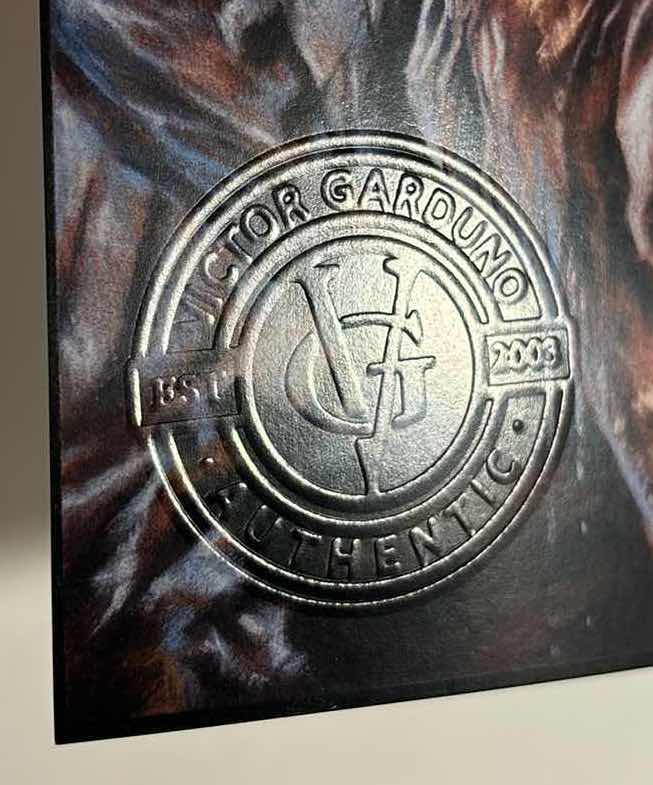 Photo 2 of VICTOR GARDUNO “DARK RAIN”  11” X 17” INFINITY GLOSS UNFRAMED PRINT W EMBOSSED SEAL, DIGITAL SIGNATURE & OFFICIAL SIGNATURE W COA INCLUDED, STORED IN A RIGID PRINT PROTECTOR SLEEVE
