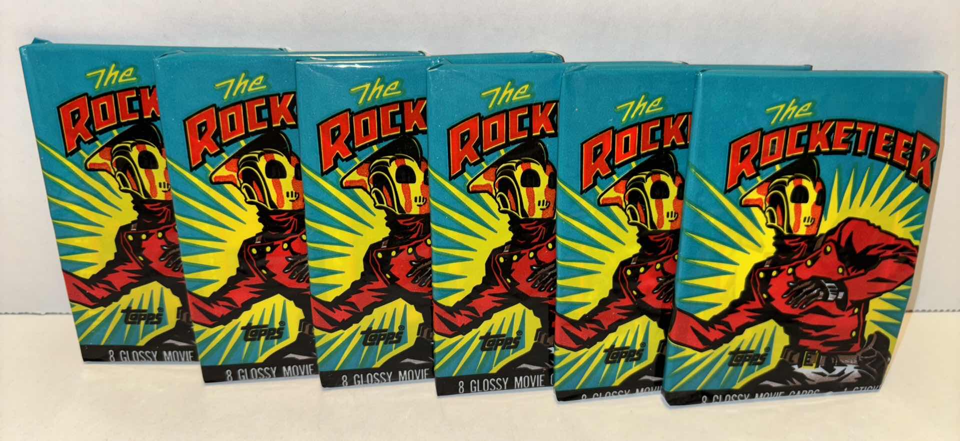 Photo 1 of NEW 6-PACK VINTAGE TOPPS 1991 COLLECTIBLE TRADING CARDS, 8 CT GLOSSY MOVIE CARDS W STICKER, “OFFICIAL ROCKETEER MOVIE SOUVENIR MAGAZINE”