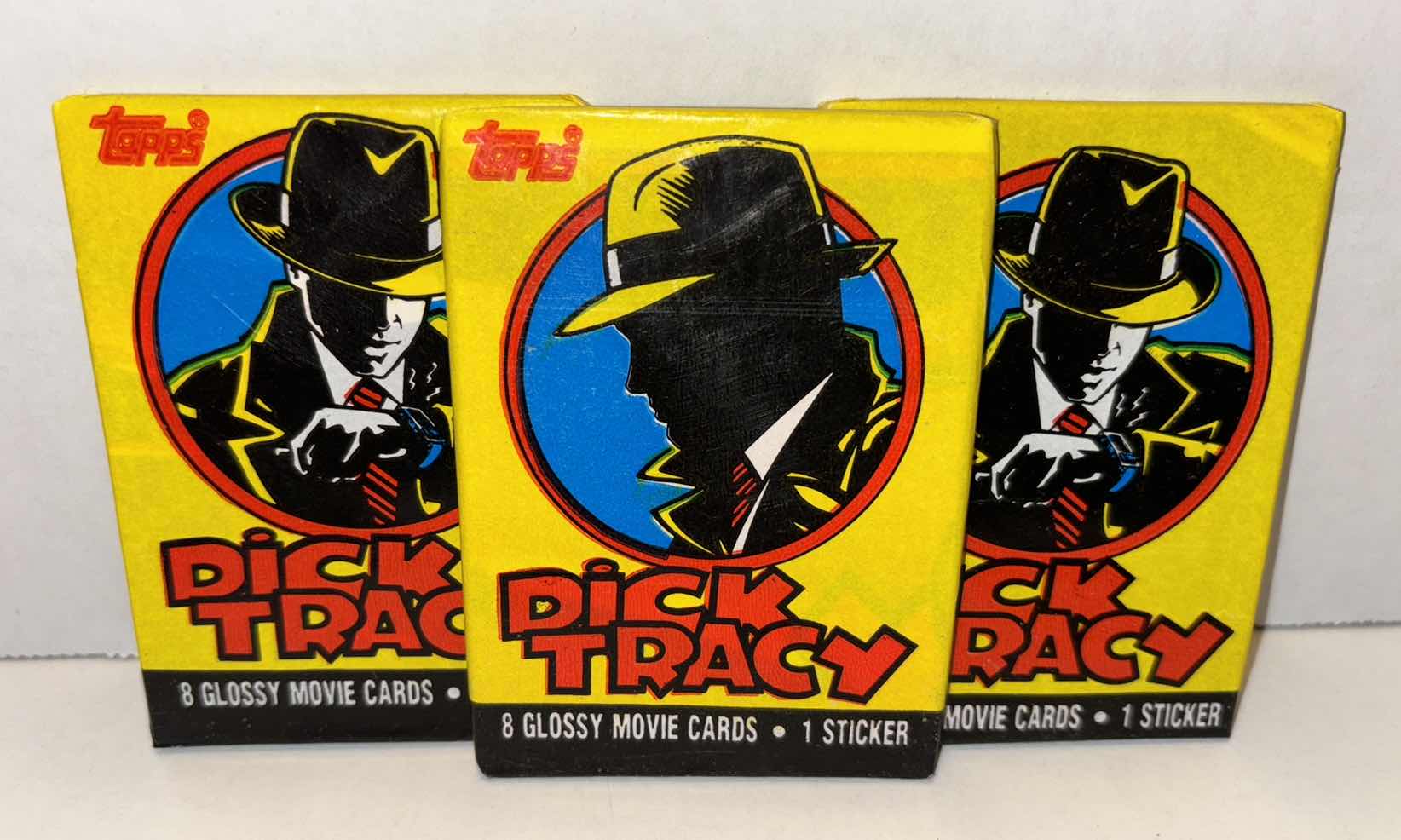 Photo 1 of NEW 3-PACK VINTAGE TOPPS 1990 COLLECTIBLE TRADING CARDS, 8 CT GLOSSY MOVIE CARDS W STICKER, “OFFICIAL DICK TRACY MOVIE SOUVENIR MAGAZINE”