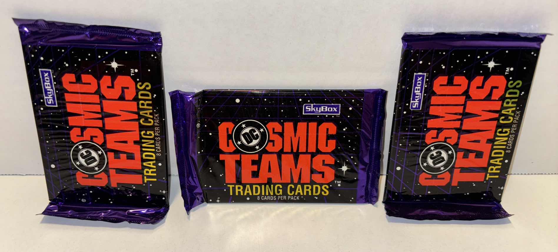 Photo 1 of NEW 3-PACK VINTAGE SKY BOX 1993 DC COMICS “COSMIC TEAMS TRADING CARDS” 8 CARDS PER PACK