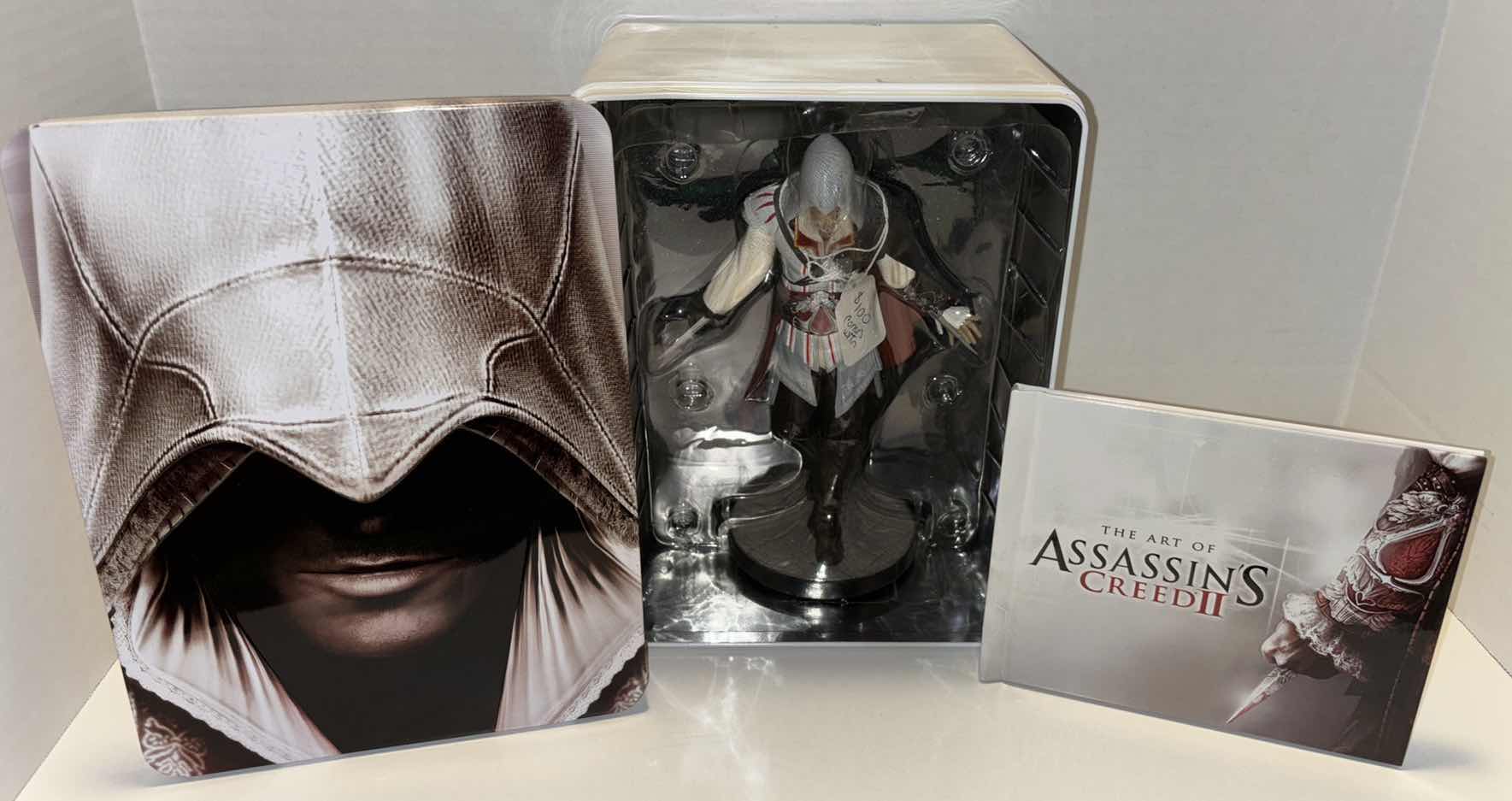 Photo 1 of UBISOFT X-BOX 360 ASSASSIN’S CREED II MASTER’S ASSASSIN’S EDITION, INCLUDES ART BOOK & STATUE IN COLLECTOR’S TIN