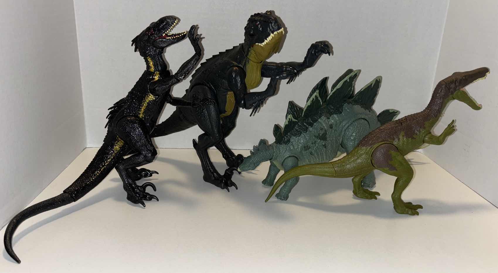 Photo 1 of JURASSIC WORLD DINOSAUR ACTION FIGURES (4 PCS- JW 14” FALLEN KINGDOM INDORAPTOR, JW SLASH N BATTLE SCORPIOS REX, JW ATTACK STEGOSAURUS &  JW ROARIVORES BARYONYX)