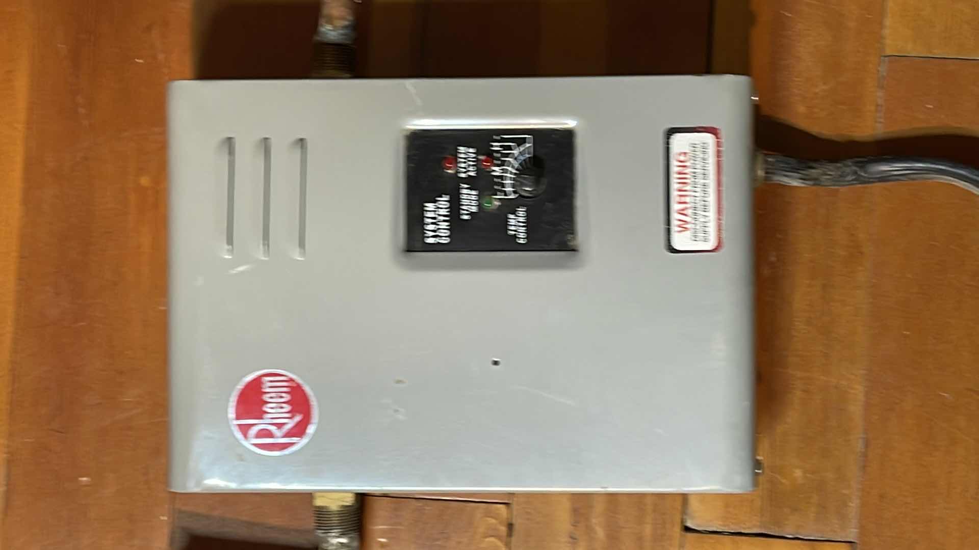 Photo 1 of RHEEM MANUFACTURING CO. ELECTRIC TANKLESS WATER HEATER MODEL RTE-13