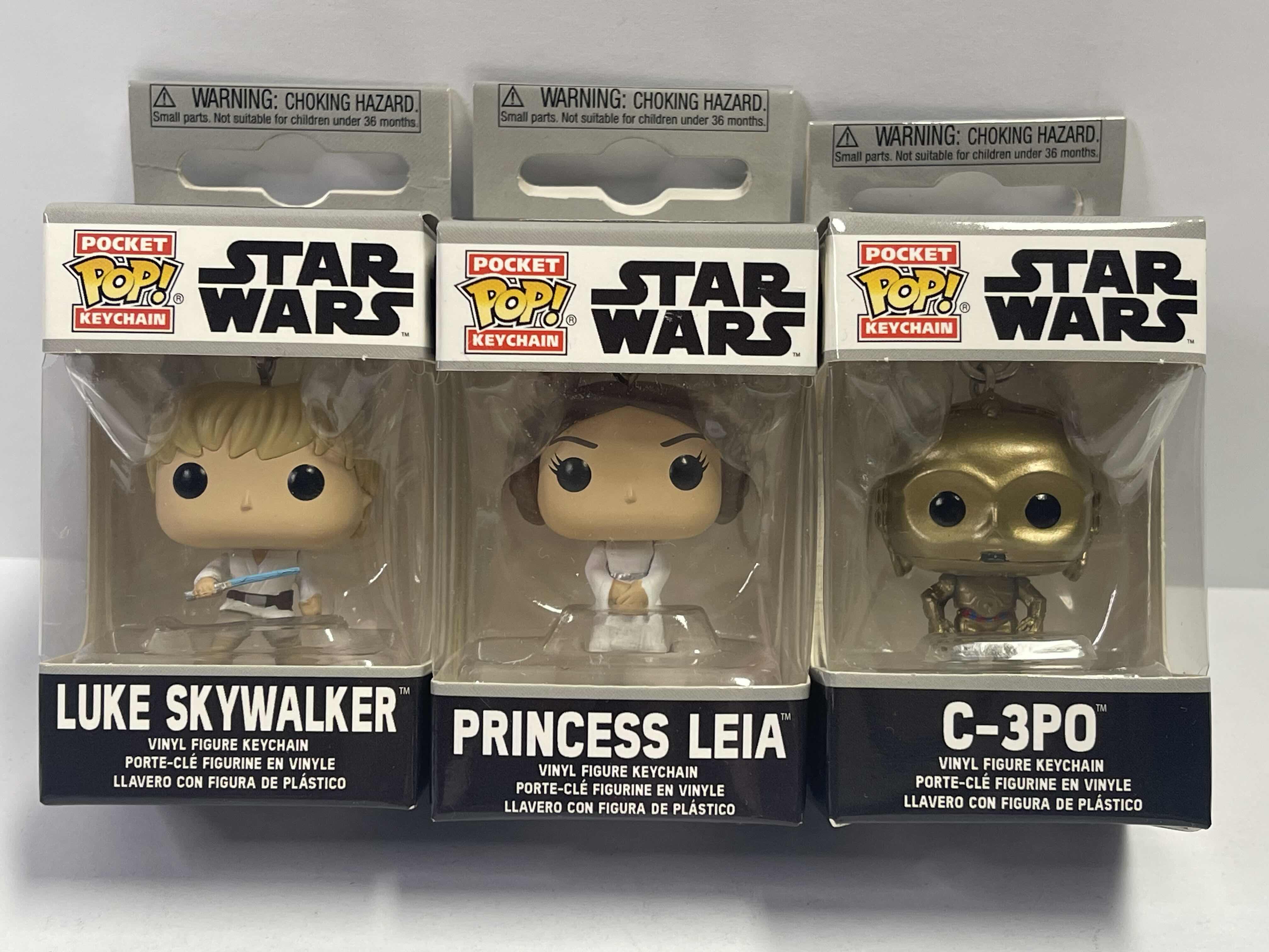 Photo 1 of NEW 3 POCKET POP KEYCHAINS “STAR WARS “ - C-3PO , PRINCESS LEIA & LUKE SKYWALKER - TOTAL RETAIL PRICE $ 32.00