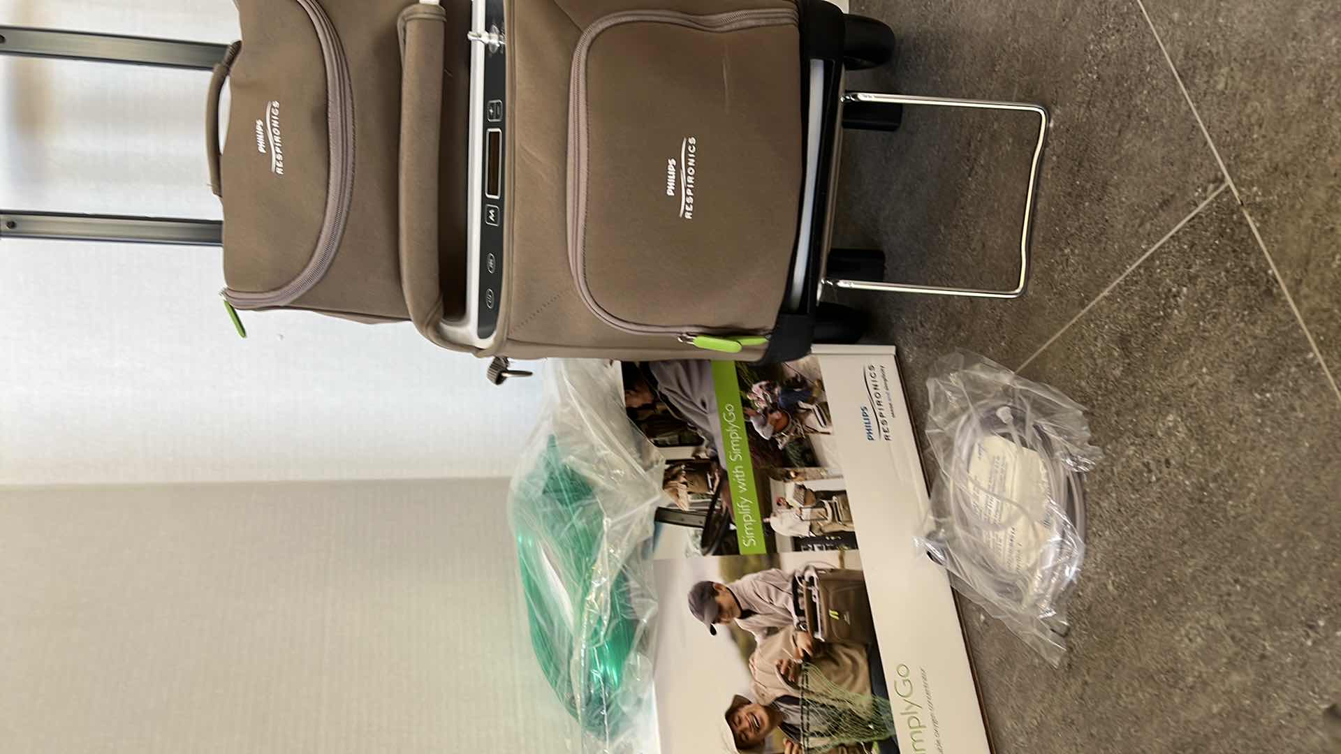 Photo 5 of PHILLIPS RESPIRONICS “SIMPLY GO” PORTABLE OXYGEN CONCENTRATOR. COMES WITH ROLLING TRAVELING BAG. EXTRA BATTERY, ACCESSORIES, AND BRAND NEW HOSES.  BARELY USED.  LIKE NEW MEDICAL EQUIPMENT.