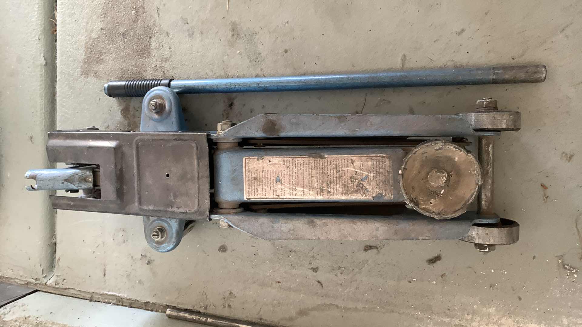 Photo 1 of AUTO PARTS-CAR LIFITNG  JACK FOR OIL CHANGES AND REPAIRS.