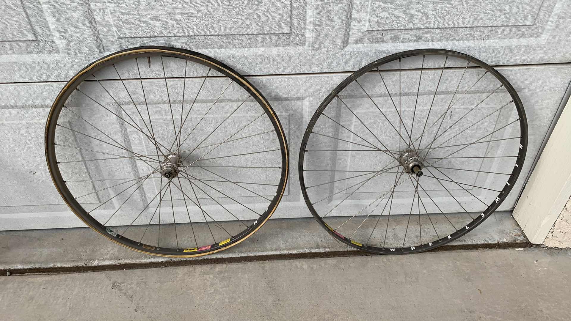 Photo 1 of 2-24” MAVIC WHEELSMITH ROAD BICYCLE RIMS, ONE WITH A TIRE. BIKE PARTS.