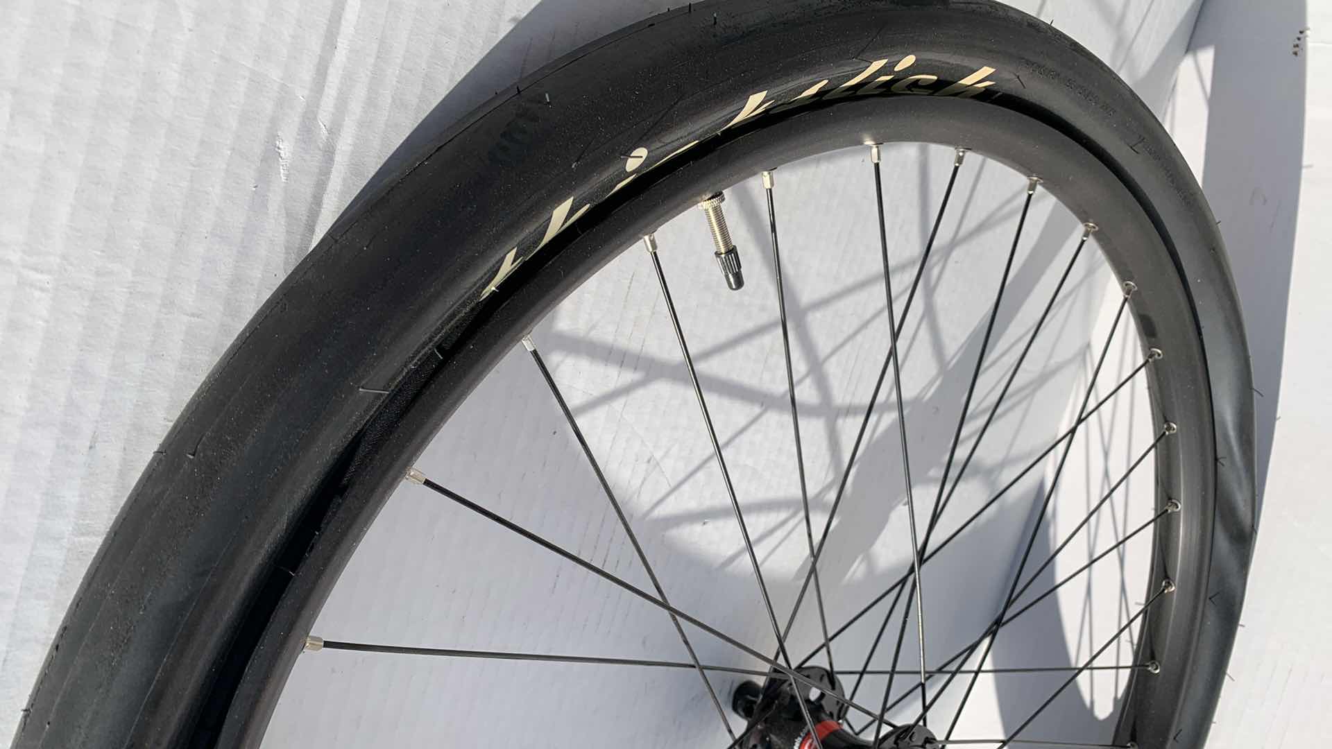 Photo 1 of 2-BICYCLE RIMS AND 1 TIRE. 27.5"D FOR A ROAD BIKE.