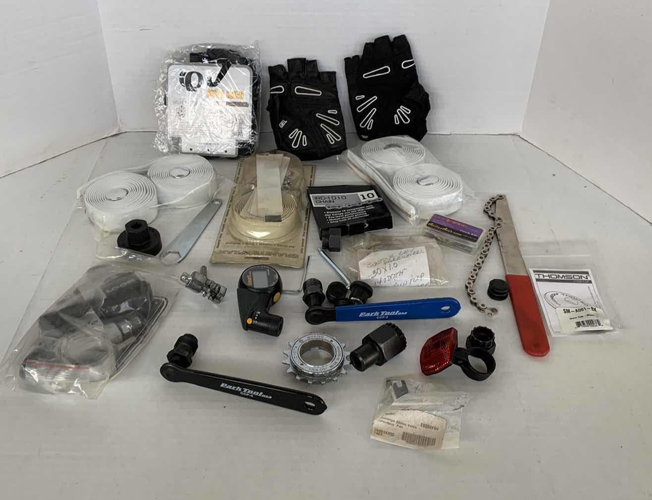 Photo 1 of ASSORTED BICYCLEPARTS AND ACCESSORIES. TOOLS, GLOVES, GAUGES ETC.