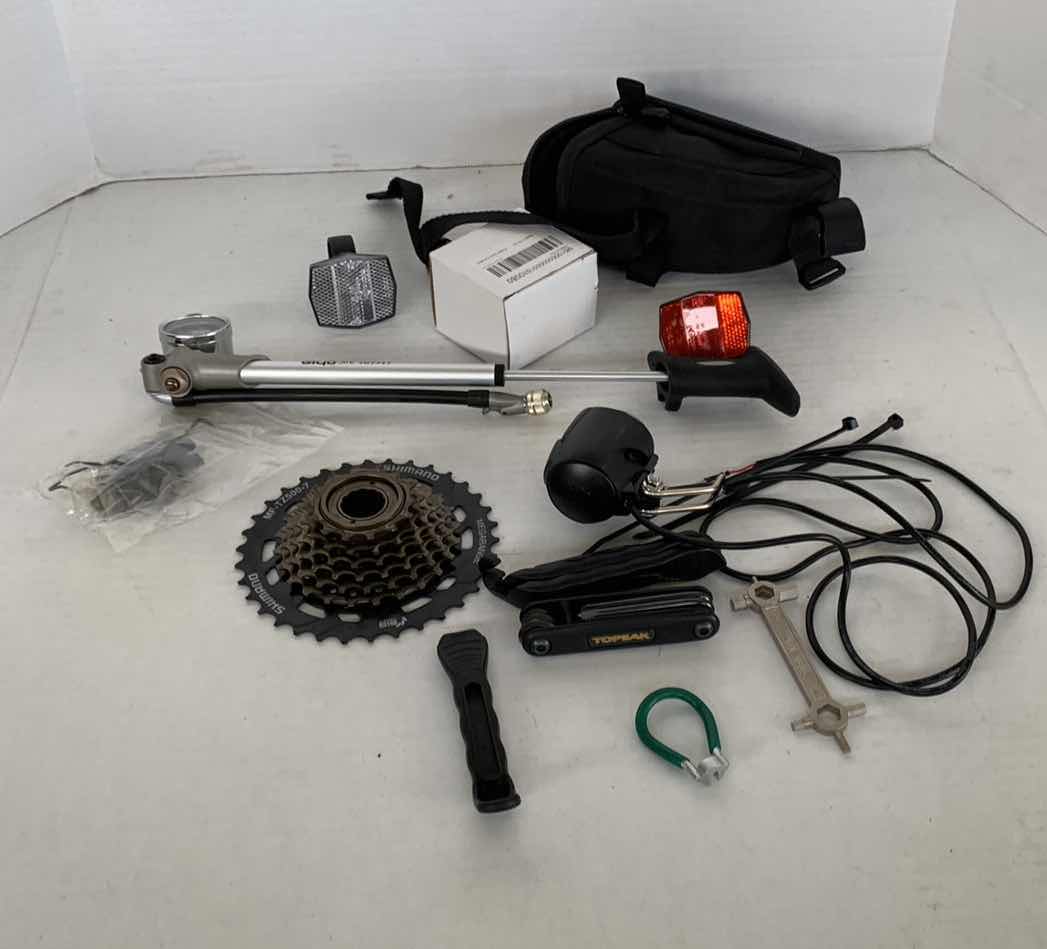 Photo 1 of ASSORTED BICYCLE PARTS AND ACCESSORIES. SPROCKET, REFLECTORS, ON PORTABLE BIKE AIR TIRE PUMP. VARIOUS TOOLS.