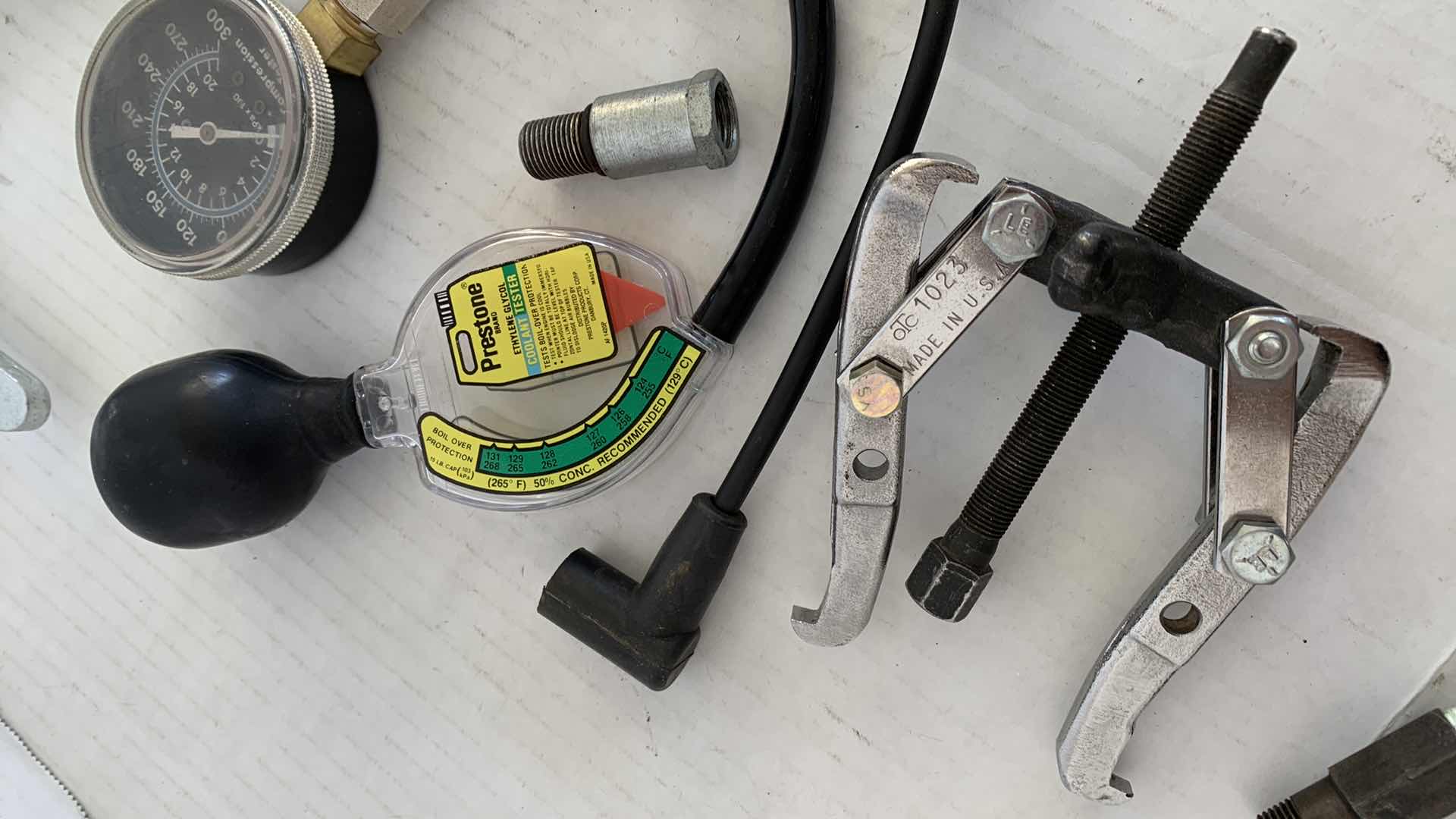 Photo 1 of AUTOPARTS-ENGINE REPAIR TOOLS INCLUDING A PISTON COMPRESSION GAUGE