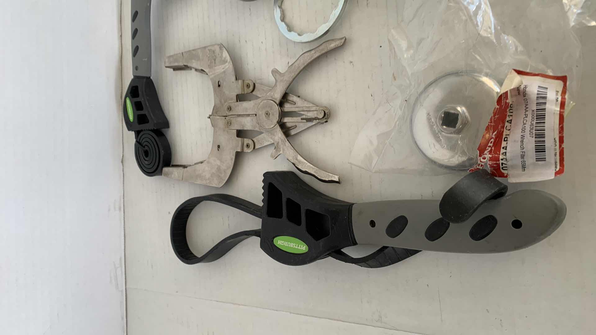 Photo 1 of AUTO PARTS.  OIL CHANGING TOOLS, FILTER WRENCHES, ETC.