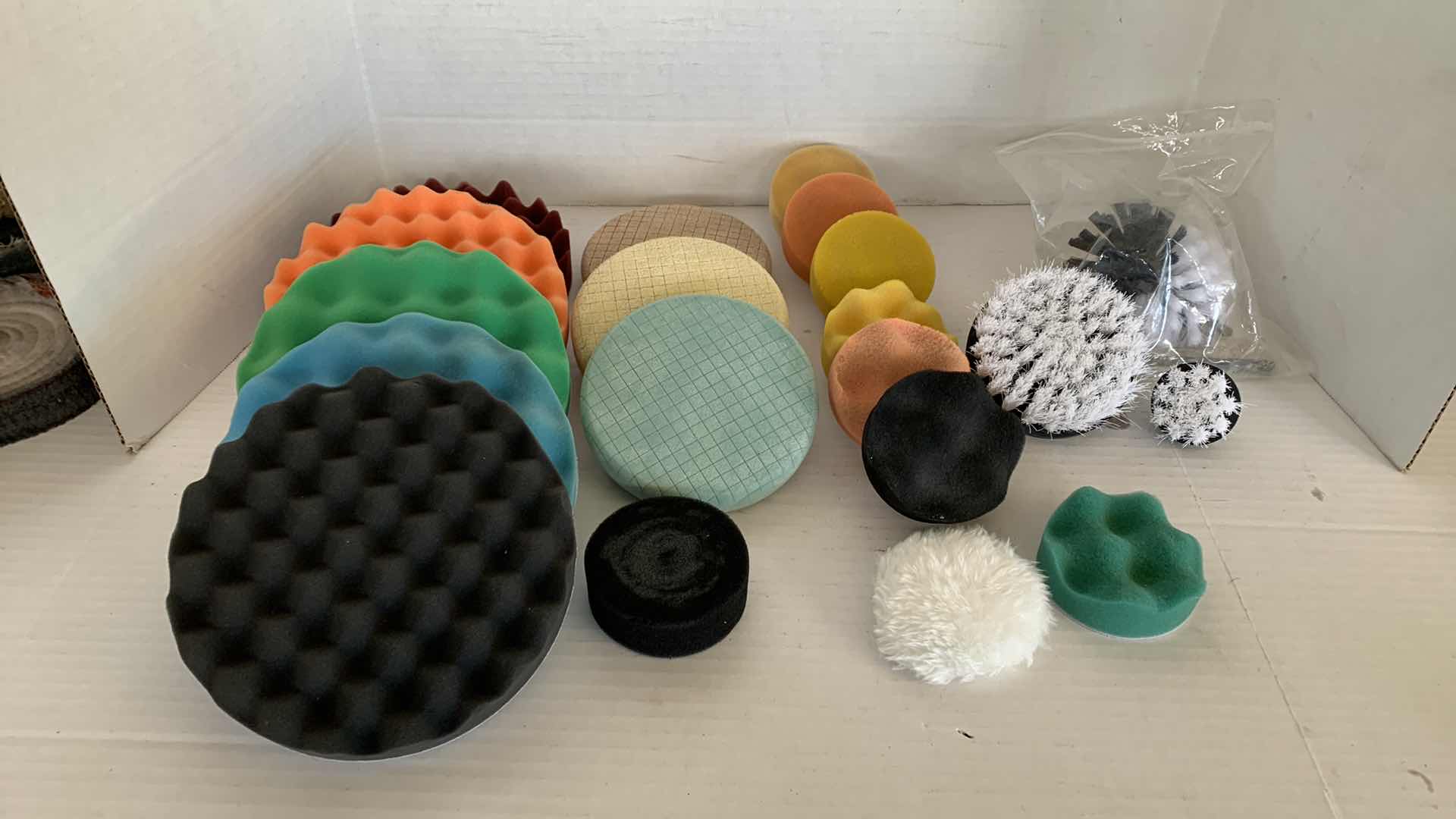 Photo 1 of CAR POLISHING PADS AND BRUSHES OF VARIOUS SIZES AND TEXTURES.