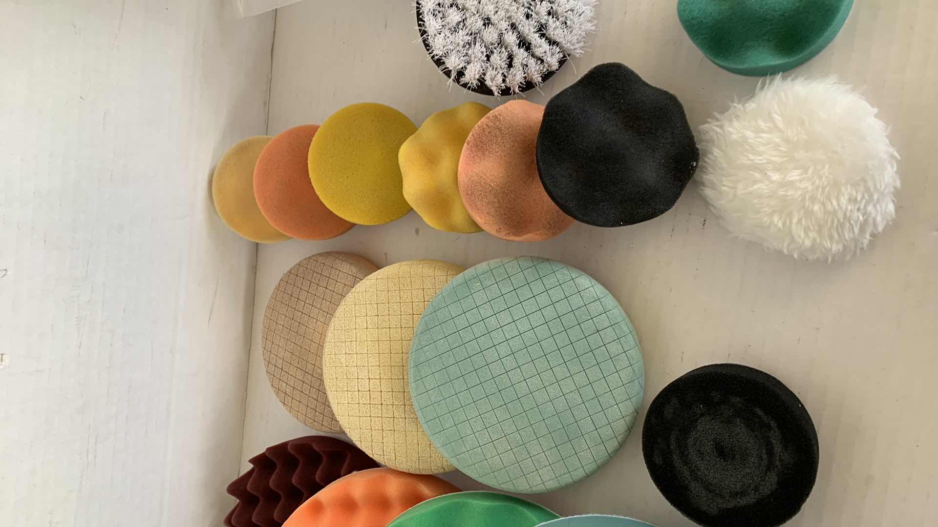 Photo 1 of CAR POLISHING PADS AND BRUSHES OF VARIOUS SIZES AND TEXTURES.