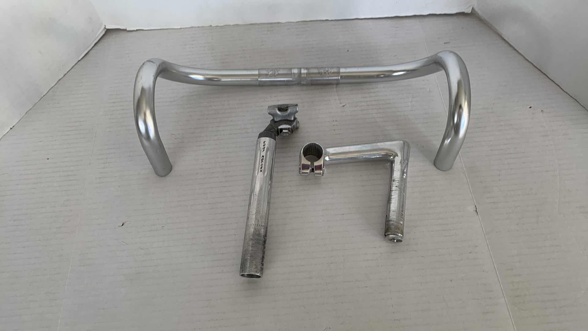 Photo 1 of CINELLI MOD. GIRO D’ITALIA BICYCLE HANDLEBARS, CAMPAGNOLO EDDY MERCKX NECK, AND ANOTHER NECK