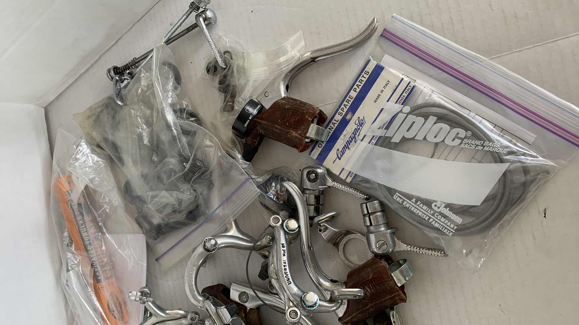 Photo 1 of BICYCLE BRAKES, FOOT STIRRUPS, AND OTHER ITEMS. ROAD BICYCLE ACCESSORIES.