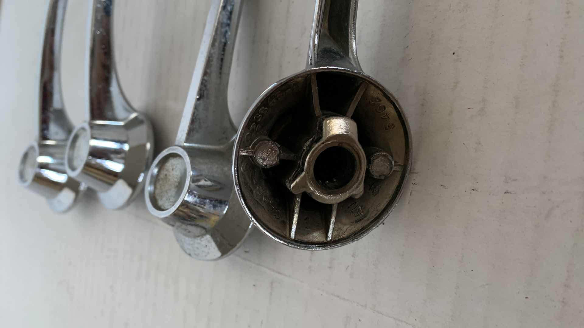 Photo 1 of 4-VINTAGE FORD AUTOMOBILE DOOR AND ROLL WINDOW HANDLES. AUTO PARTS.
