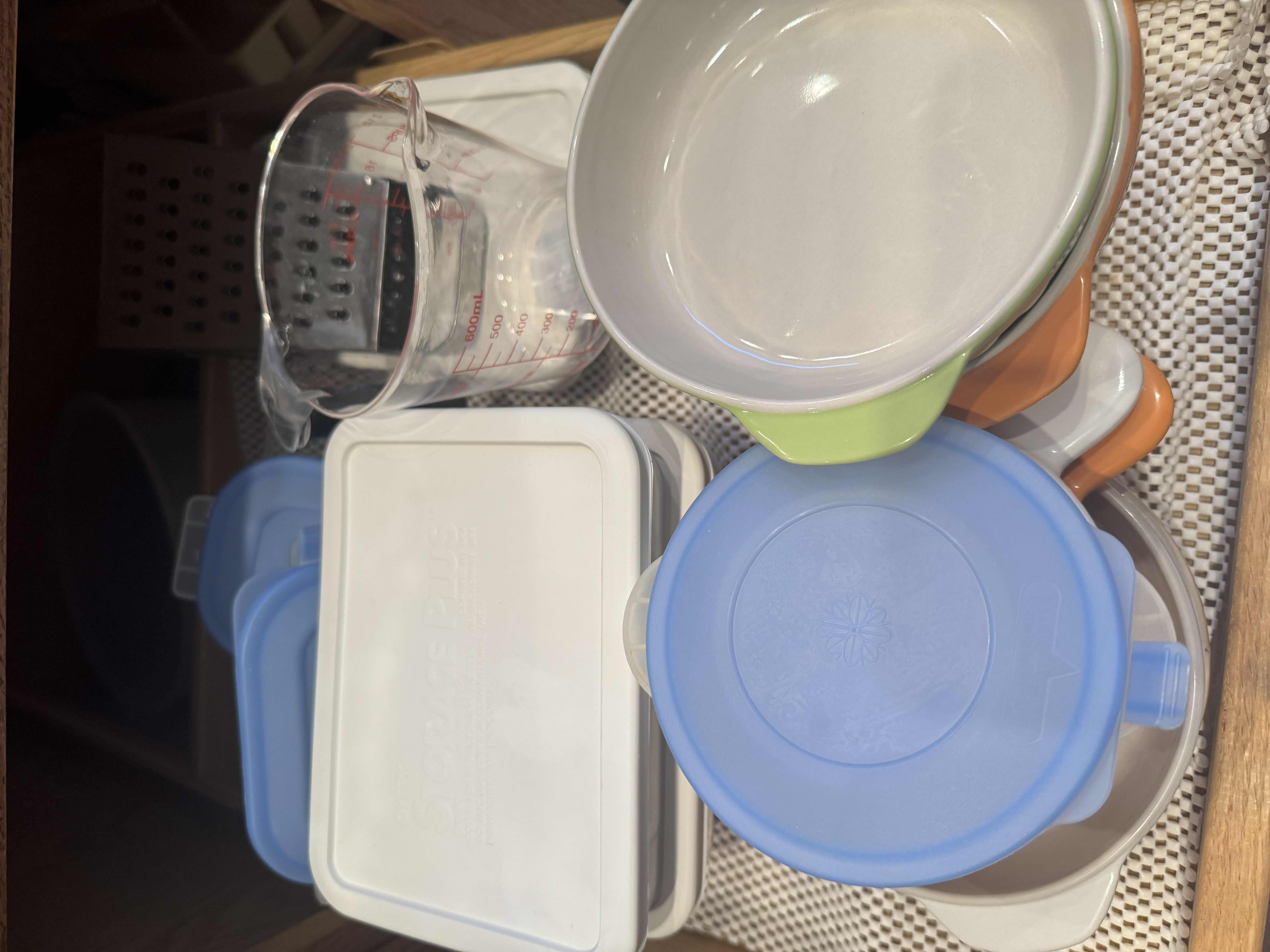 Photo 1 of CONTENTS OF KITCHEN CABINET. MIXING AND SERVING BOWLS AND DISHES. POTS AND PANS, AND BAKING DISHES.