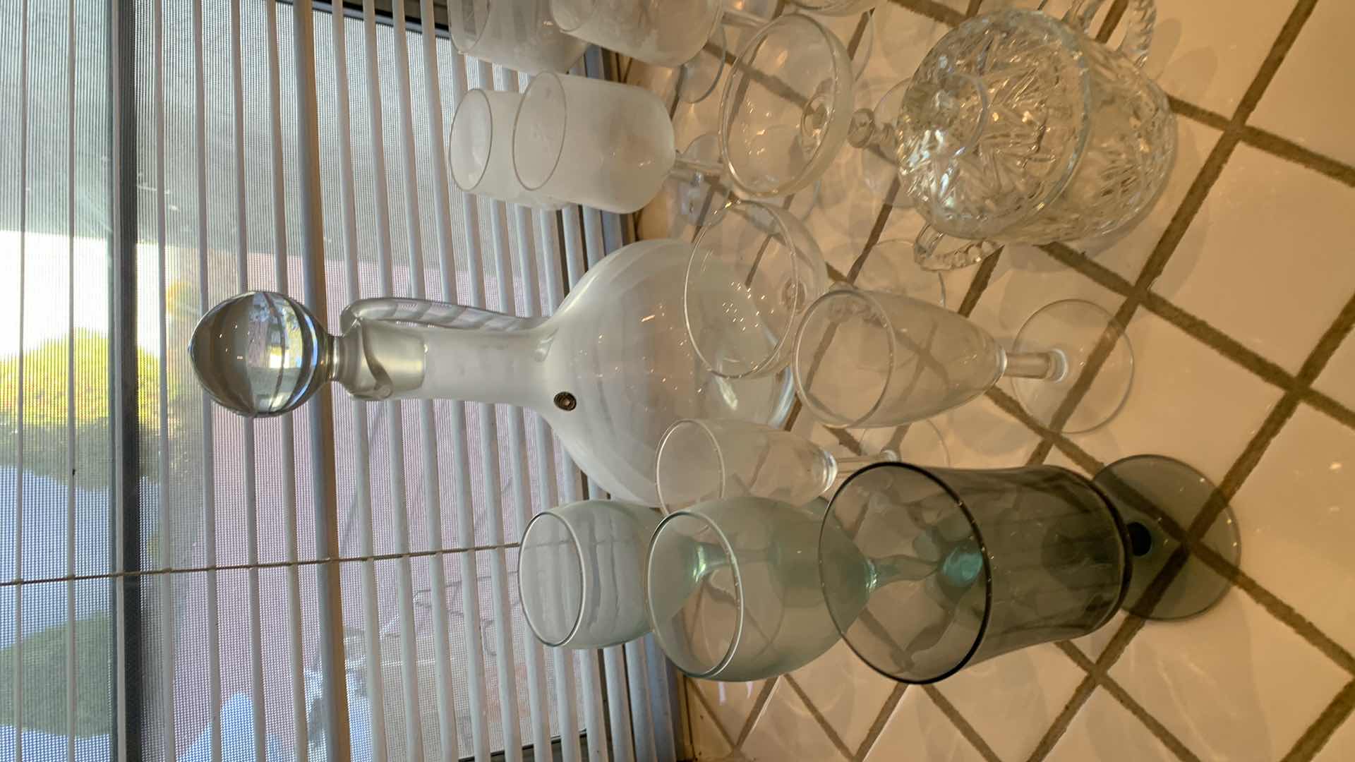 Photo 1 of ASSORTED GLASS AND BARWARE. WINE DECANTER, MARTINI GLASSES, CHRYSTAL CANDY JAR WITH LID, AND SALT AND PEPPER SHAKERS.