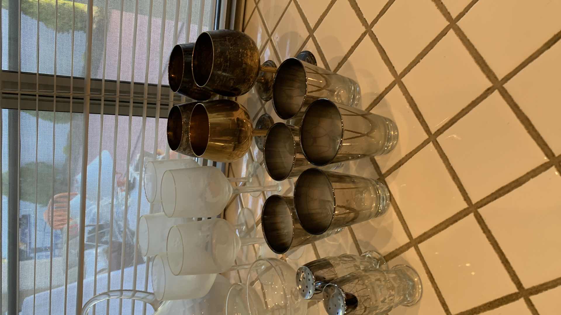 Photo 1 of ASSORTED GLASS AND BARWARE. WINE DECANTER, MARTINI GLASSES, CHRYSTAL CANDY JAR WITH LID, AND SALT AND PEPPER SHAKERS.