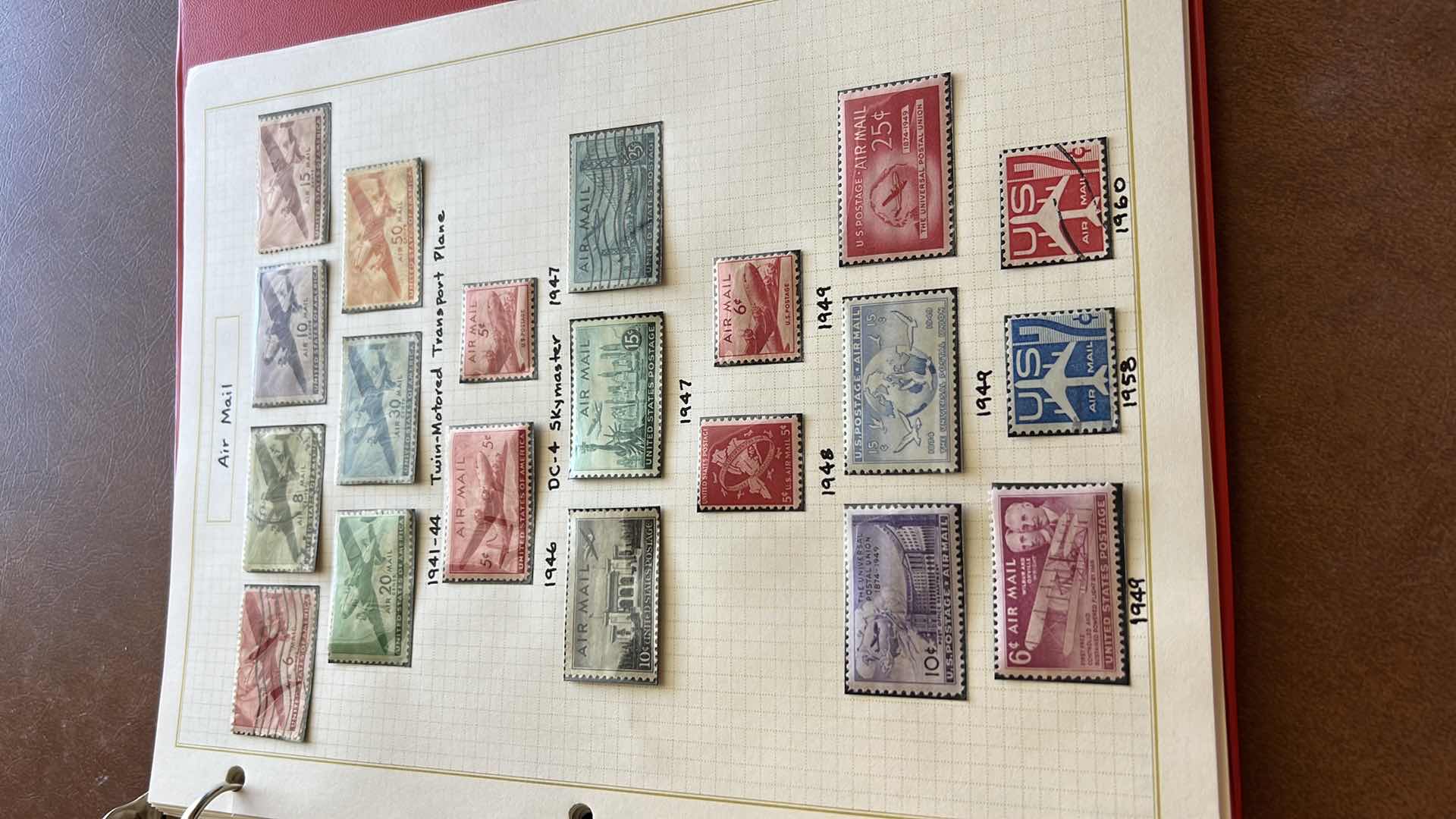 Photo 1 of US POSTAGE STAMP BINDER AND CONTENTS - NO RETURNS
