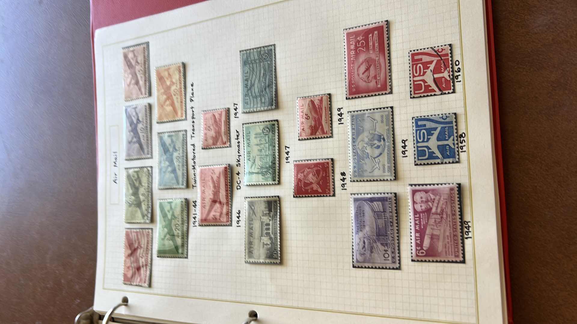 Photo 1 of US POSTAGE STAMP BINDER AND CONTENTS - NO RETURNS