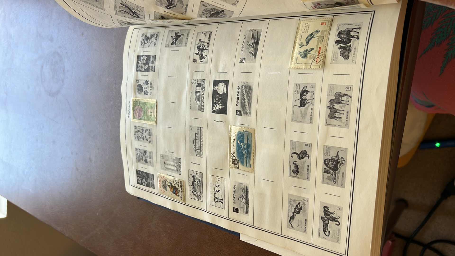 Photo 1 of “POSTAGE STAMPS OF THE UNITED STATES” ALBUM (NO CONTENT) AND “AMBASSADOR’S FOR STAMPS OF THE WORLD” SEVERAL PAGES OF MINT AND CANCELLED FOREIGN STAMPS STAMPS - NO RETURNS