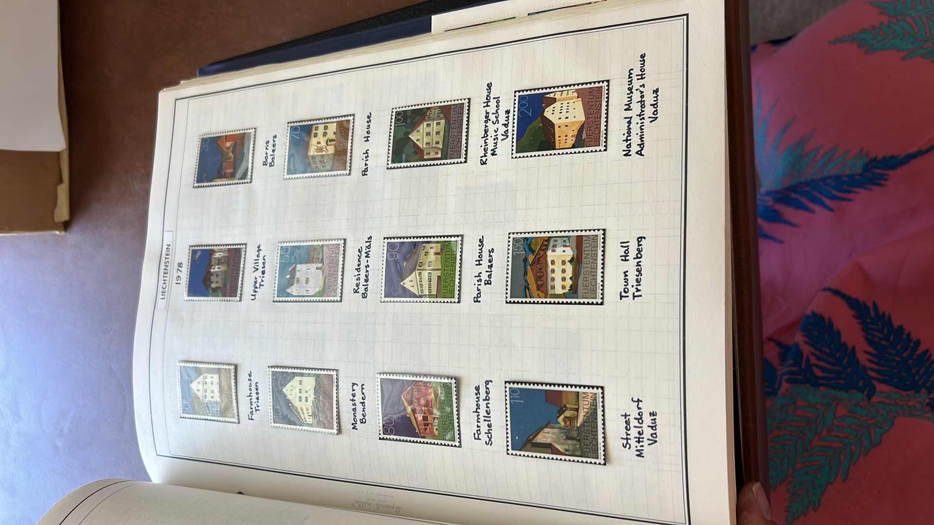 Photo 1 of “POSTAGE STAMPS OF THE UNITED STATES” ALBUM (NO CONTENT) AND “AMBASSADOR’S FOR STAMPS OF THE WORLD” SEVERAL PAGES OF MINT AND CANCELLED FOREIGN STAMPS STAMPS - NO RETURNS