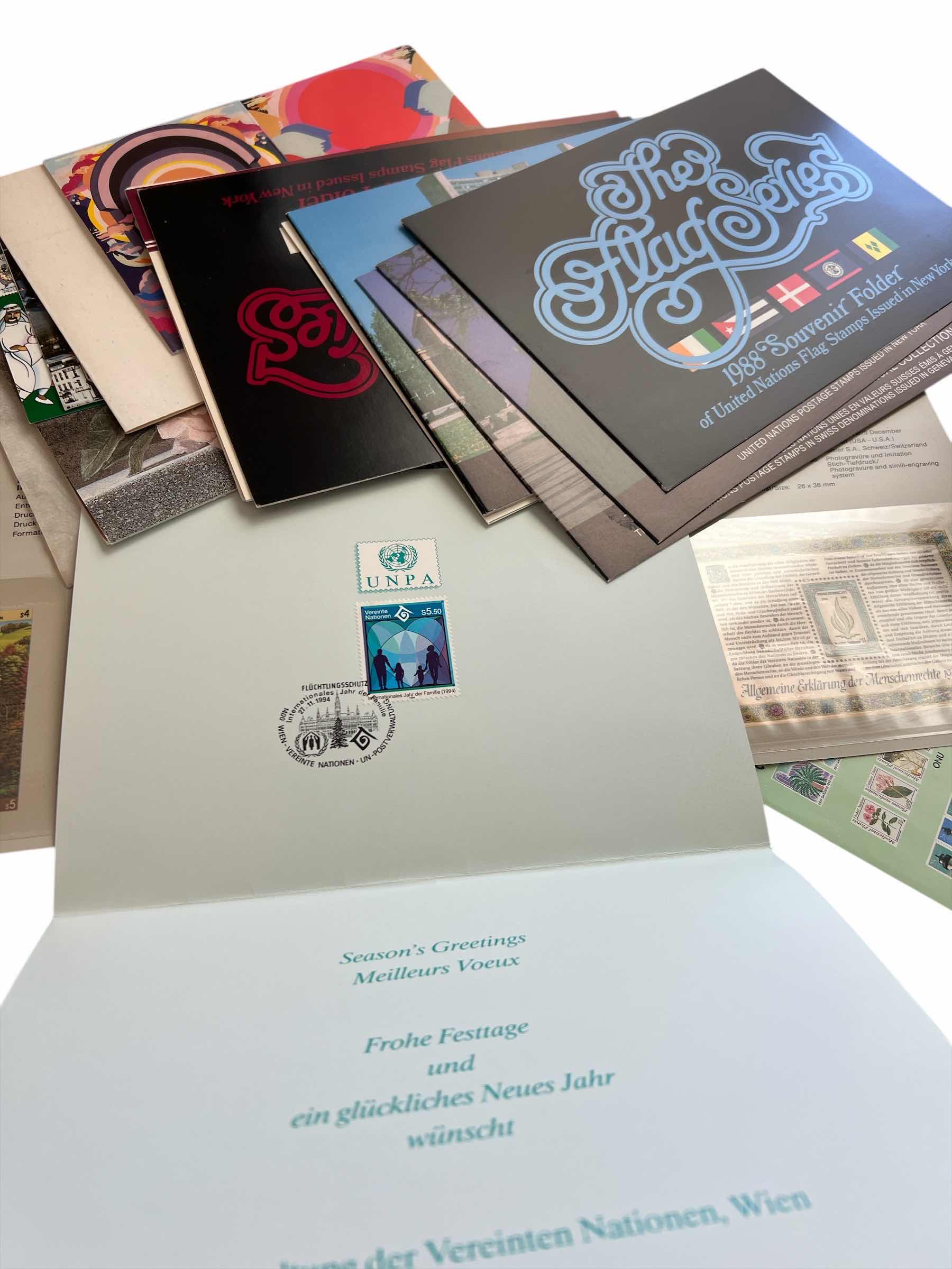 Photo 1 of LARGE COLLECTION OF MODERN ERA UNITED NATIONS FIRST DAY OF ISSUE, SINGLE STAMP COMMERATIVE FOLDERS AND UN POSTAL SERVICE ADVERTISING BROCHERES