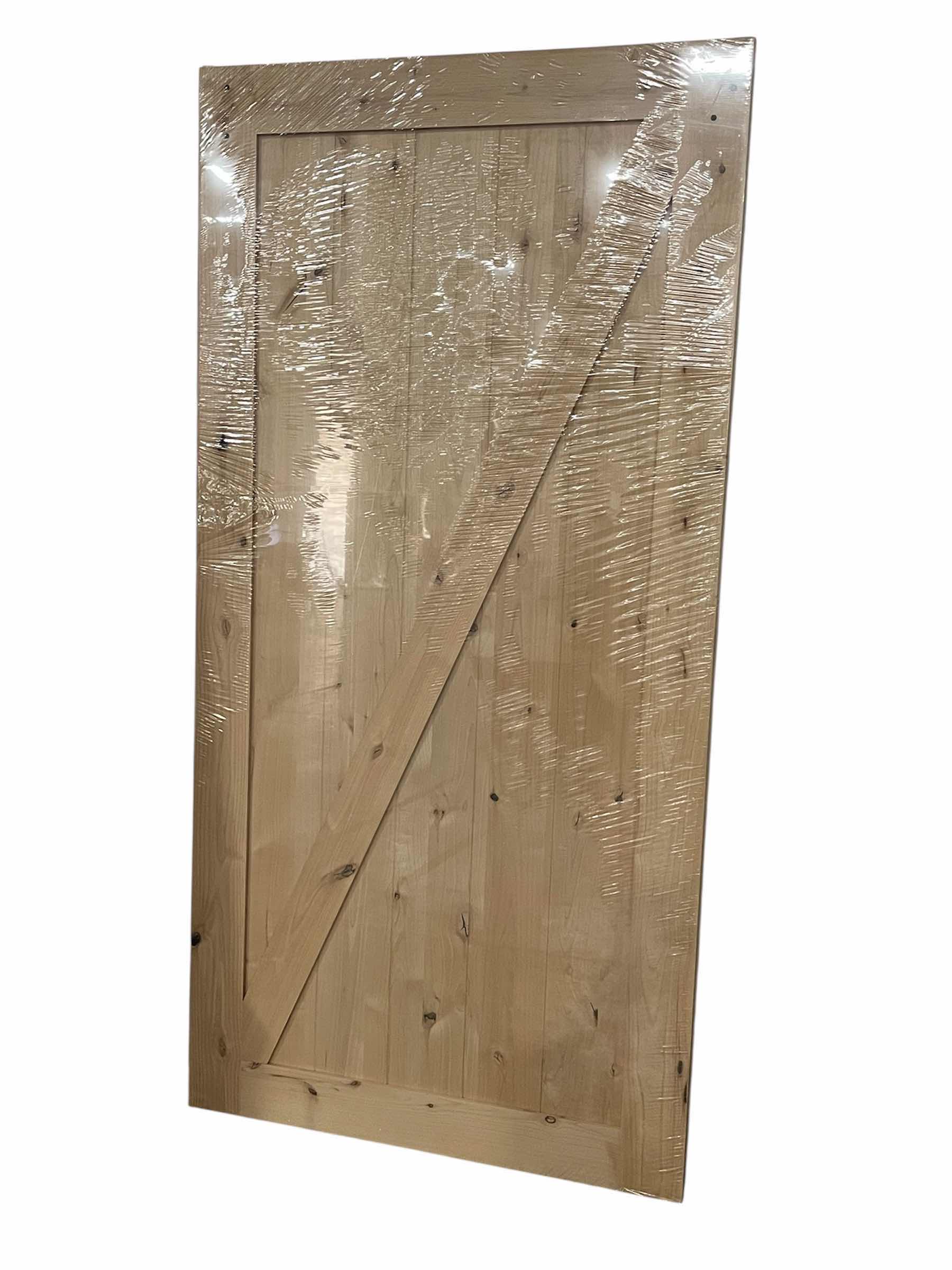 Photo 1 of NEW MASONITE Z-BAR KNOTTY ALDER WOOD INTERIOR BARN DOOR 42” X 84” (BARN DOOR ONLY)