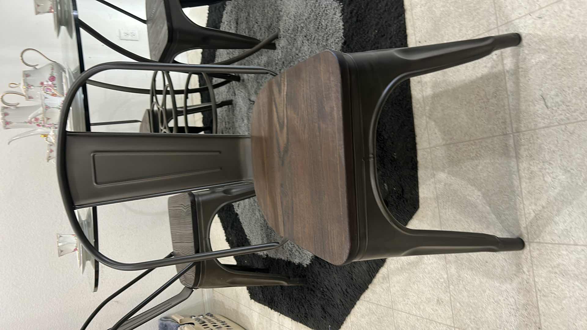 Photo 2 of METAL GLASS TOP 4’ ROUND TABLE WITH 4 METAL AND WOOD CHAIRS (CHINA SOLD SEPARATELY)