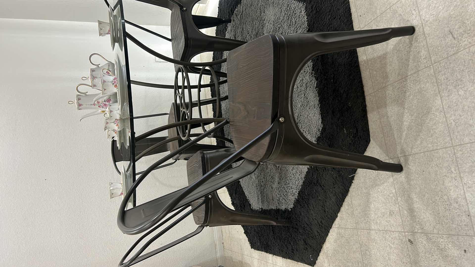 Photo 3 of METAL GLASS TOP 4’ ROUND TABLE WITH 4 METAL AND WOOD CHAIRS (CHINA SOLD SEPARATELY)