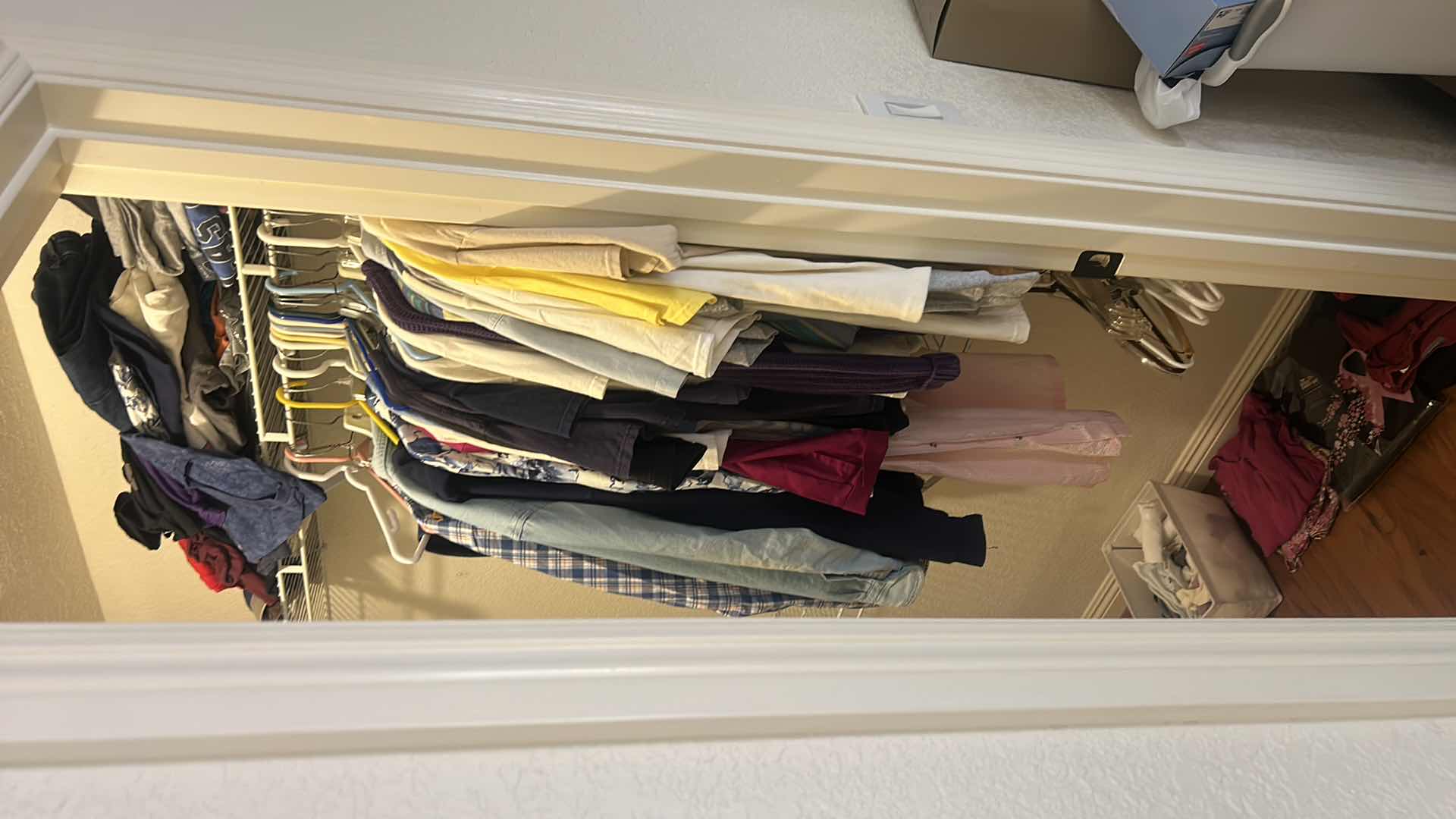 Photo 1 of CONTENTS RIGHT SIDE OF CLOSET- WOMEN AND MENS CLOTHING