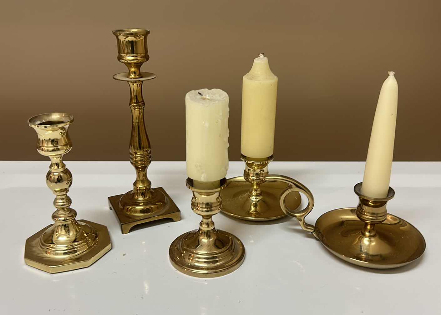 Photo 1 of BRASS CANDLE HOLDER ASSORTMENT (TALLEST 7.5”)