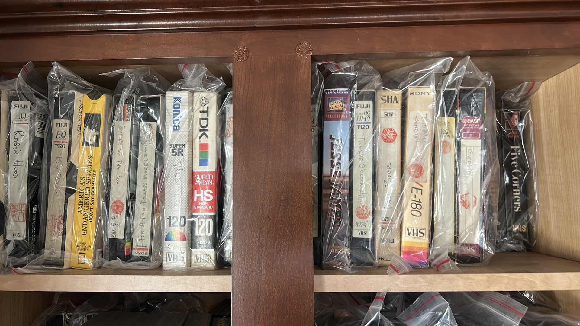 Photo 1 of 2 ROWS VHS TAPES