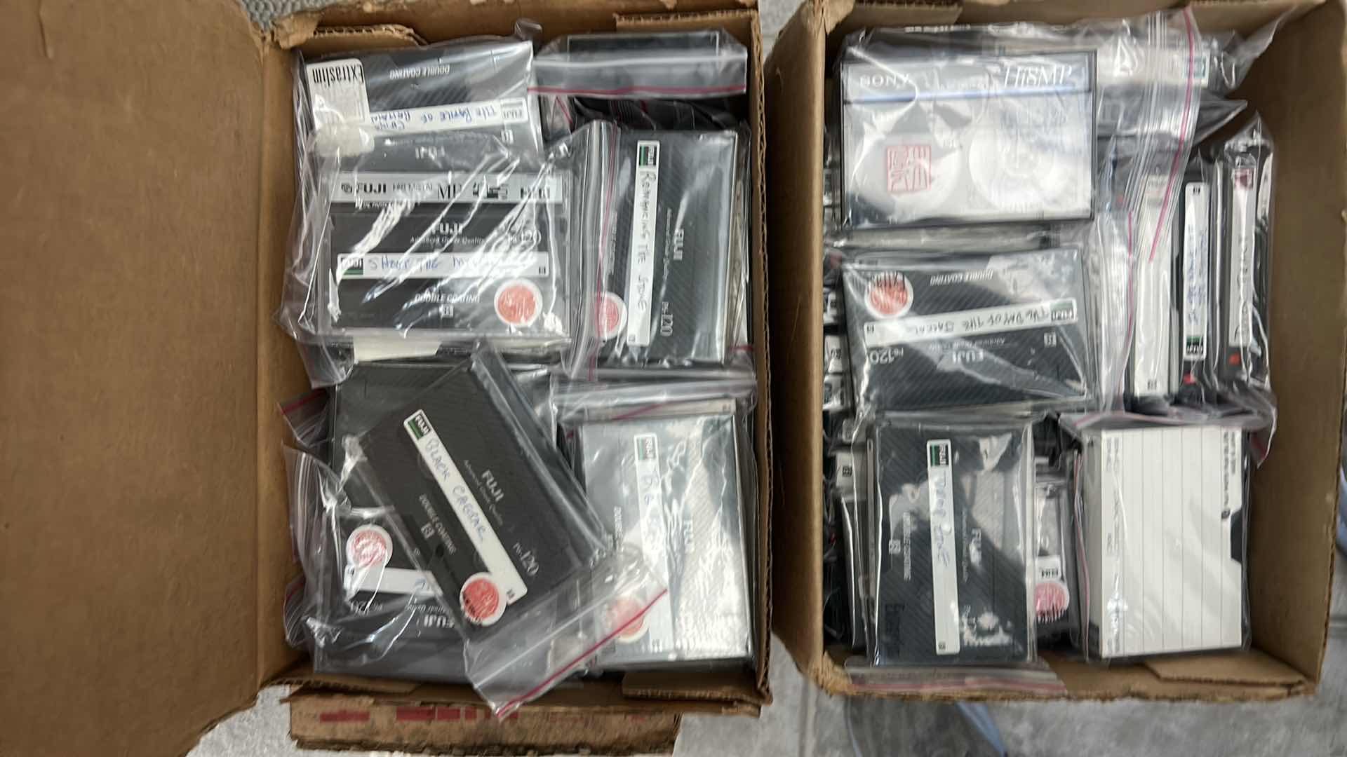 Photo 1 of 2 BOXES OF MOVIES ON CASSETTE