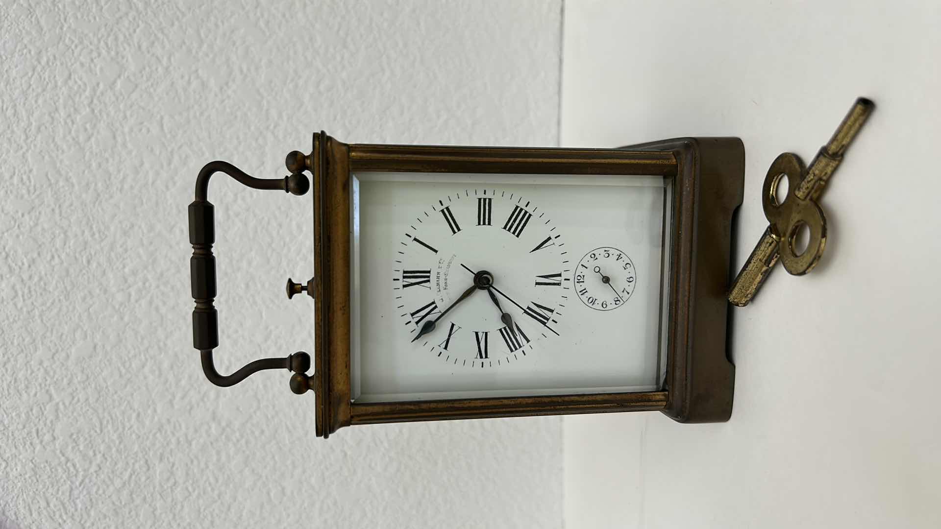 Photo 1 of ANTIQUE BRASS CHIMING CLOCK H5”