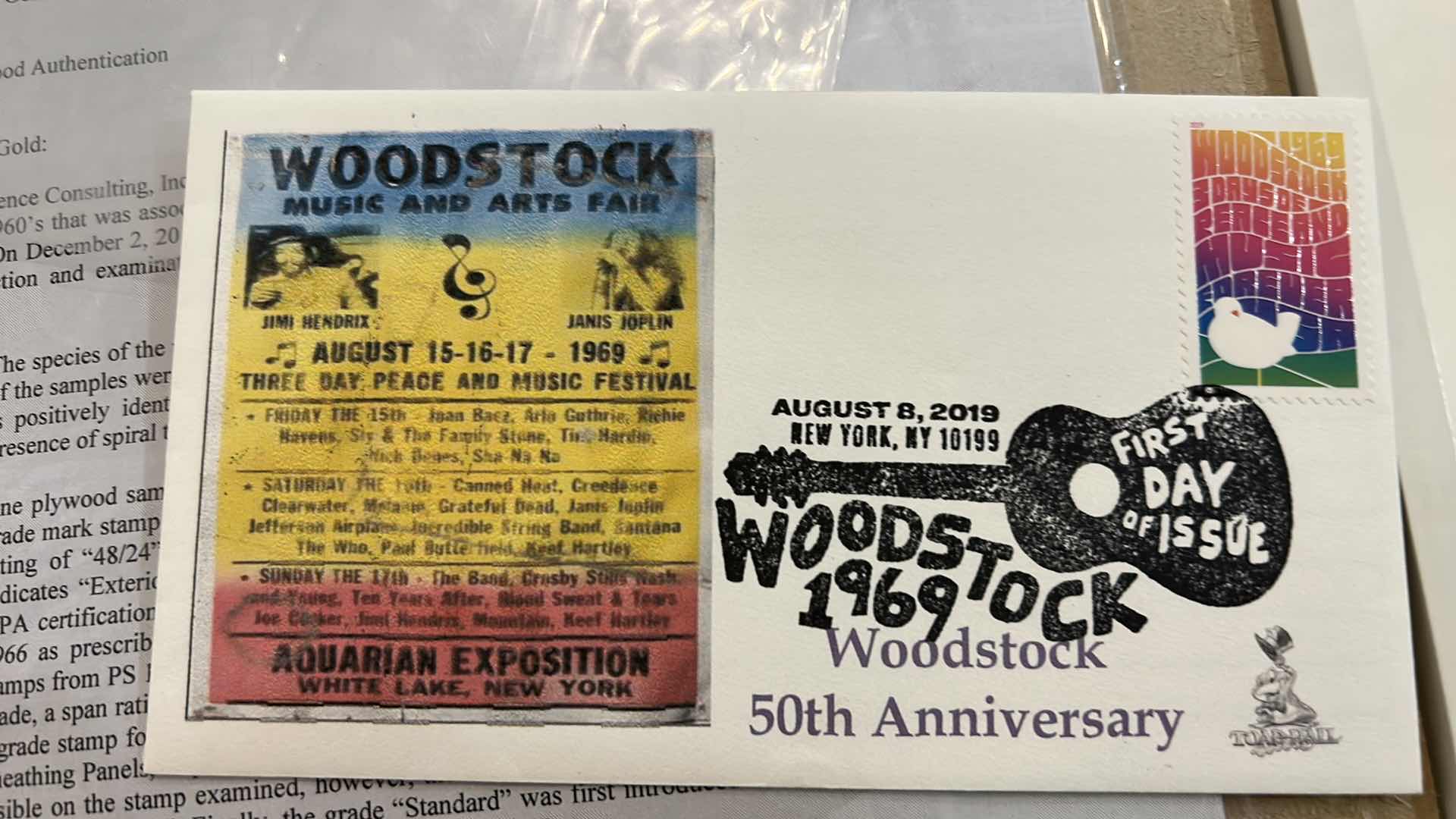 Photo 11 of AUTHENTIC WOODSTOCK FESTIVAL 1969 MEMORABILIA IN ORIGINAL DESIGNED SHADOW BOX. 12“ x 15“INCLUDES WOODSTOCK TICKET, PIECE OF THE GATE AND PIECE OF THE STAGE. GATE AND STAGE CRAFTED INTO PEACE SIGNS. DOCUMENTATION AND AUTHENTICITY PAPERS INCLUDED.