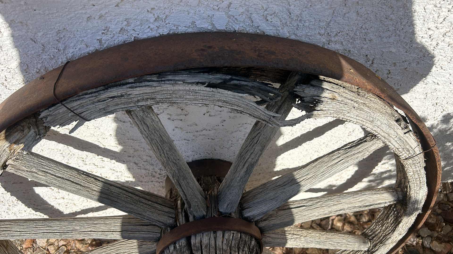 Photo 3 of ANTIQUE WOOD AND FORGED BRONZE WAGON WHEEL 3’