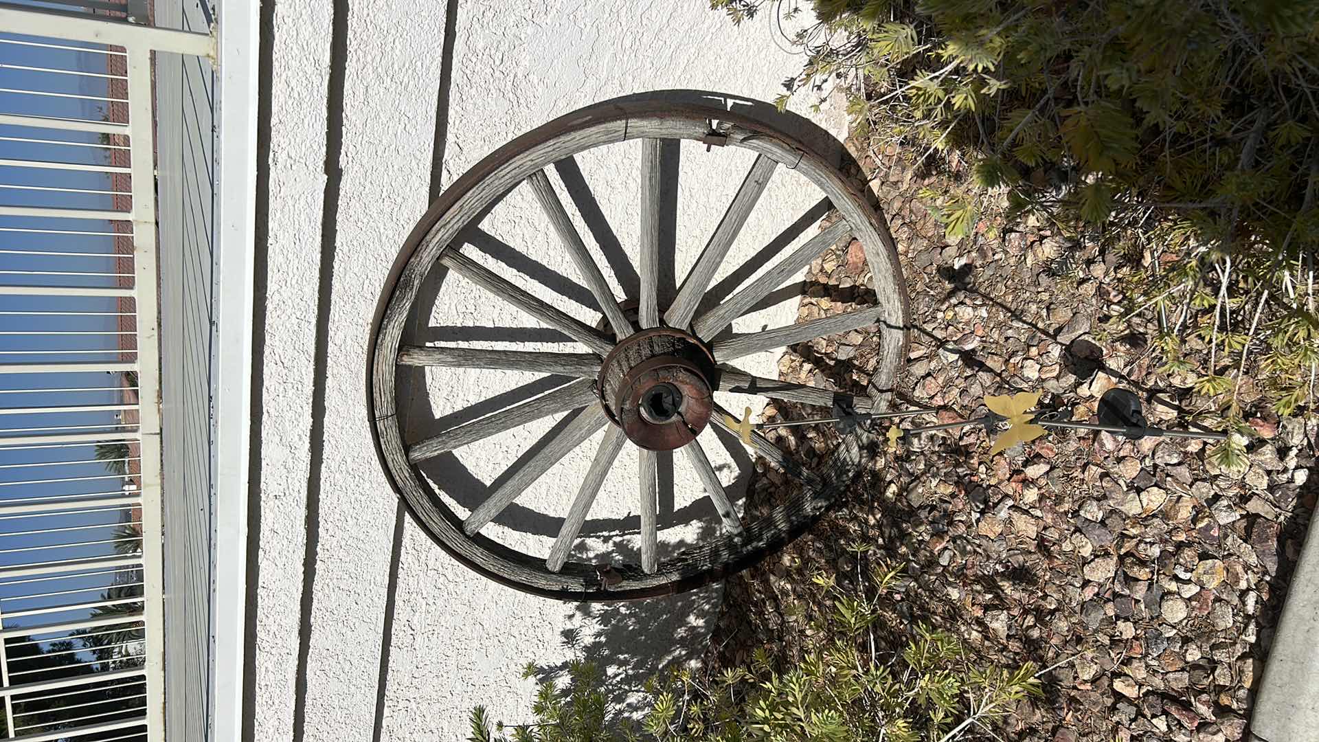 Photo 1 of ANTIQUE WOOD AND FORGED BRONZE WAGON WHEEL 42”